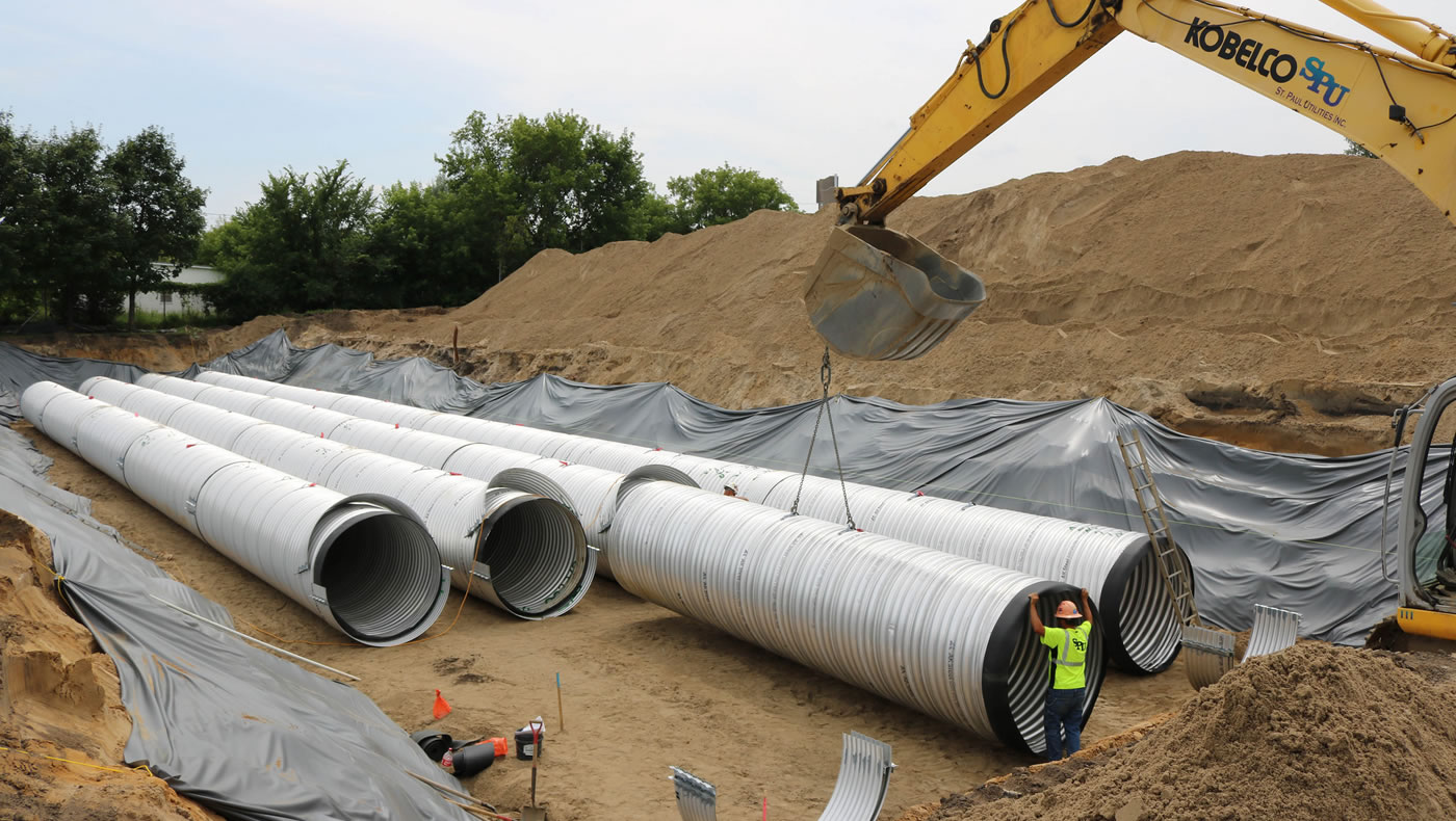 Workers assemble the storage tanks at Edison High School.