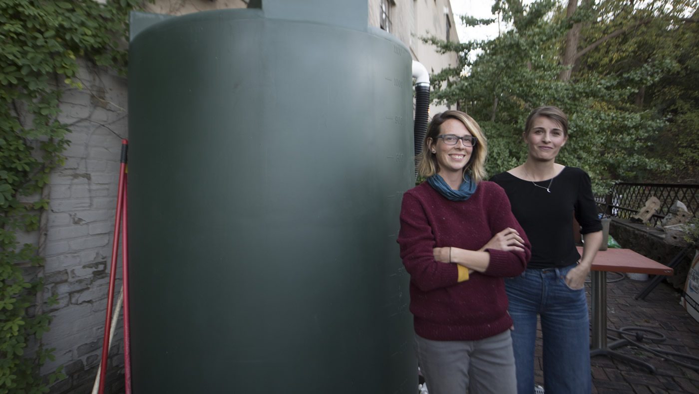 Master Water Stewards standing next to cistern.