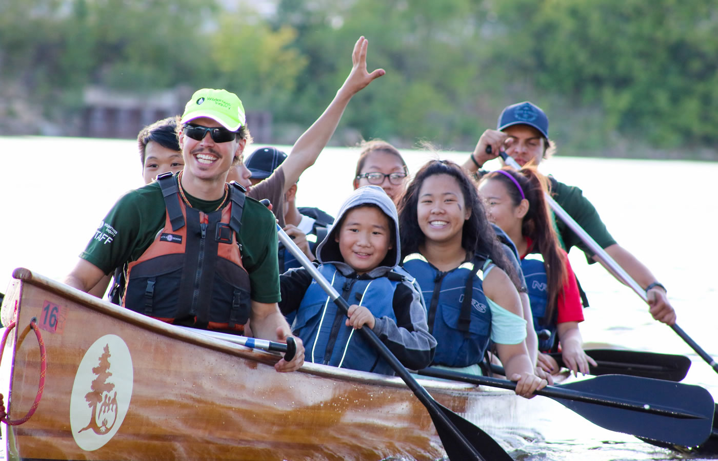 A group of paddlers in a Wilderness Inquiry canoe at Share the River Nordeast.