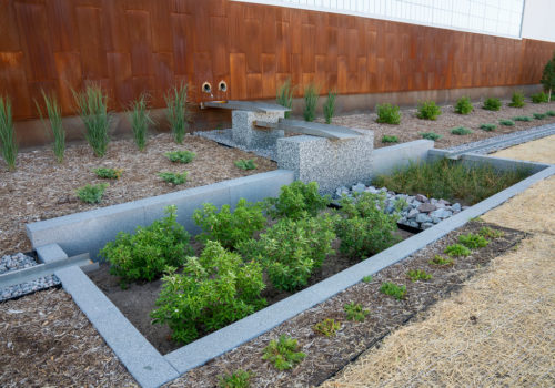 A rain garden in front of the East Side Storage and Maintenance Facility.