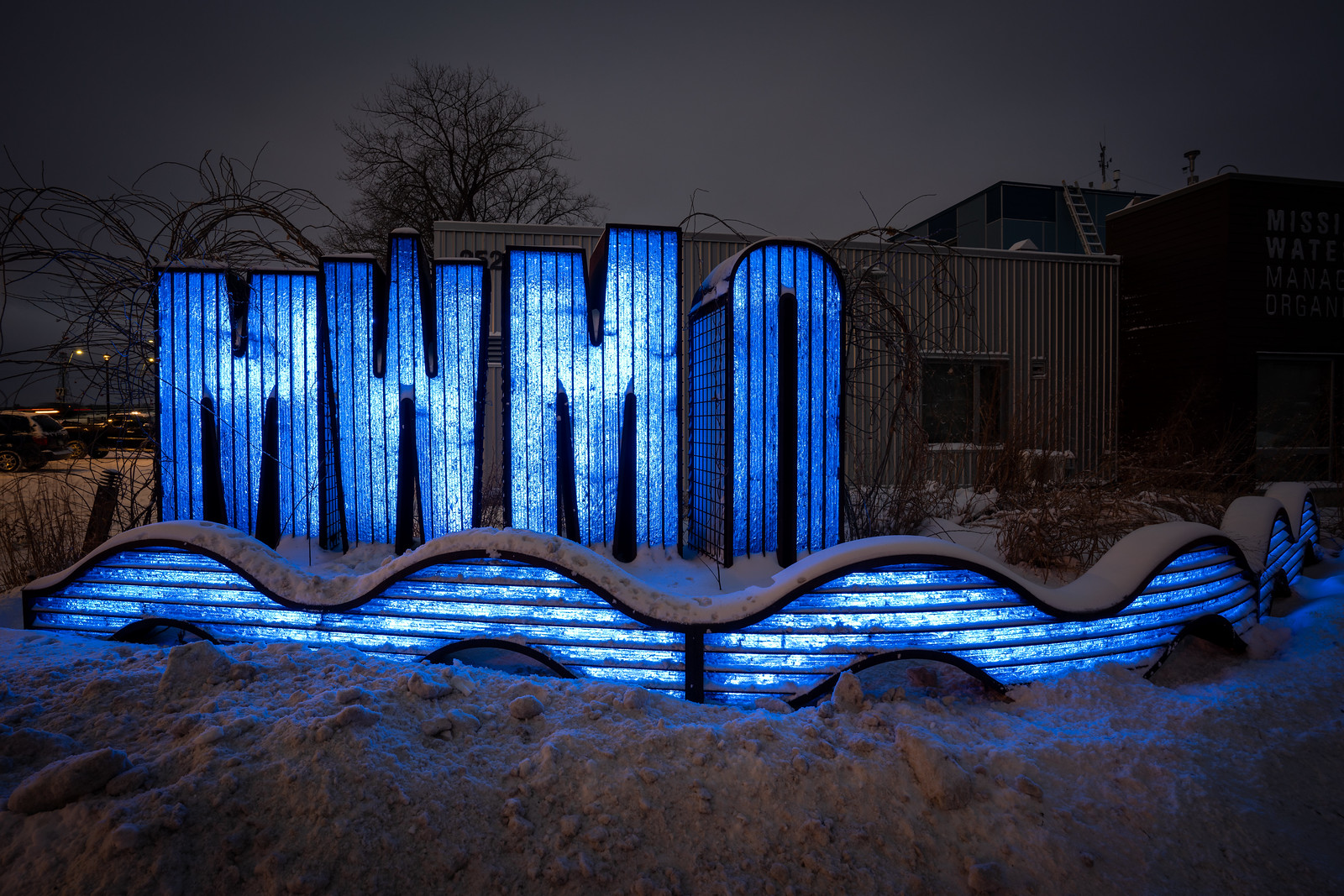 MWMO sign sculpture at night.