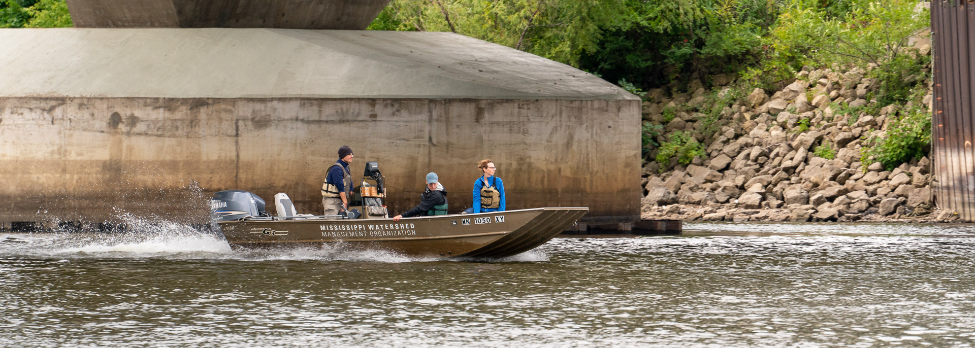 The MWMO boat cruises on the Mississippi River.