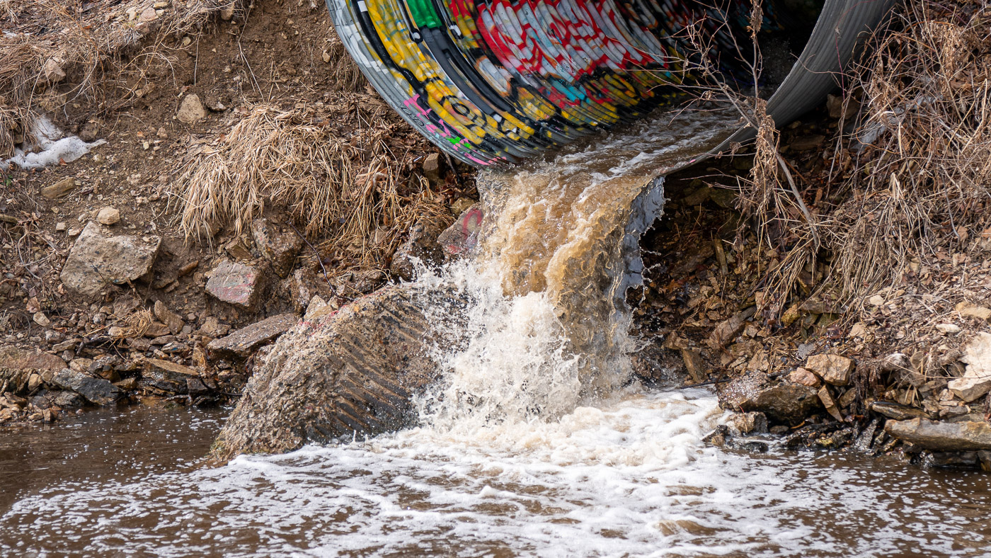 Runoff gushes from a stormwater outfall in the Mississippi River Gorge.