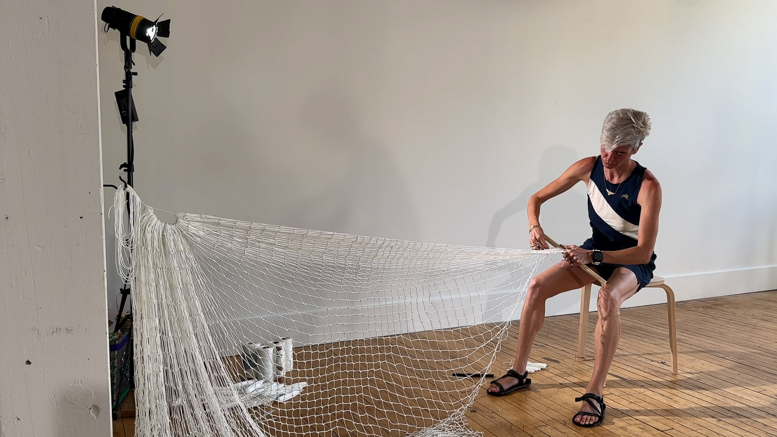 Artist Victoria Bradford Styrbicki making a net.