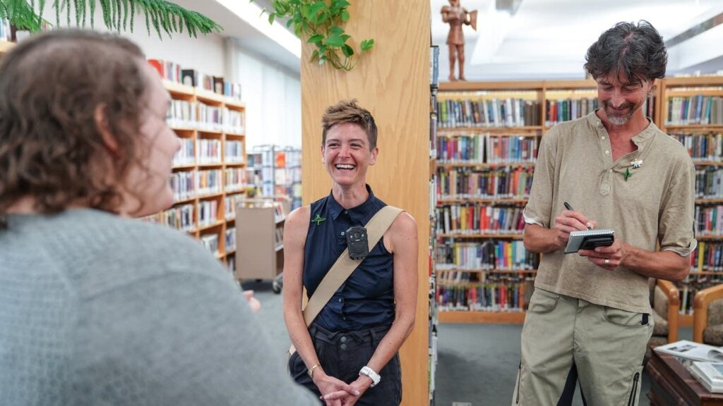 Victoria Bradford Styrbicki (left) and Tom Styrbicki talk with head librarian Abby Smith at the Jessie F. Hallett Memorial Library in Crosby, Minnesota on July 21. Victoria and Tom traveled the length of the Mississippi River, starting at the headwaters, and meeting with local residents in just over 100 communities along the way. They're trip is documented in the exhibit “Network: A River Connected."