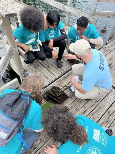 Mississippi River Green Team youths explored macroinvertebrates with the Minneapolis Park & Recreation Board's water quality staff. 